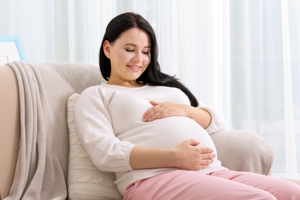 woman pregnant at home